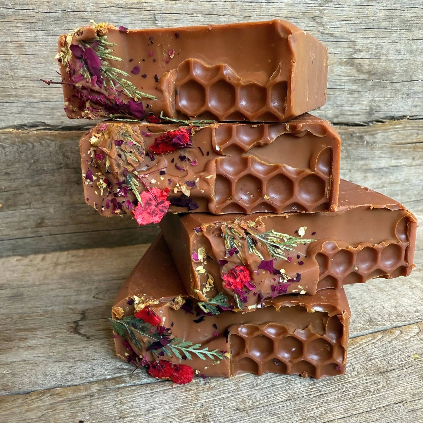 Close-up of Casablanca Curing Clay highlighting organic tallow for skin soap with pressed flowers.