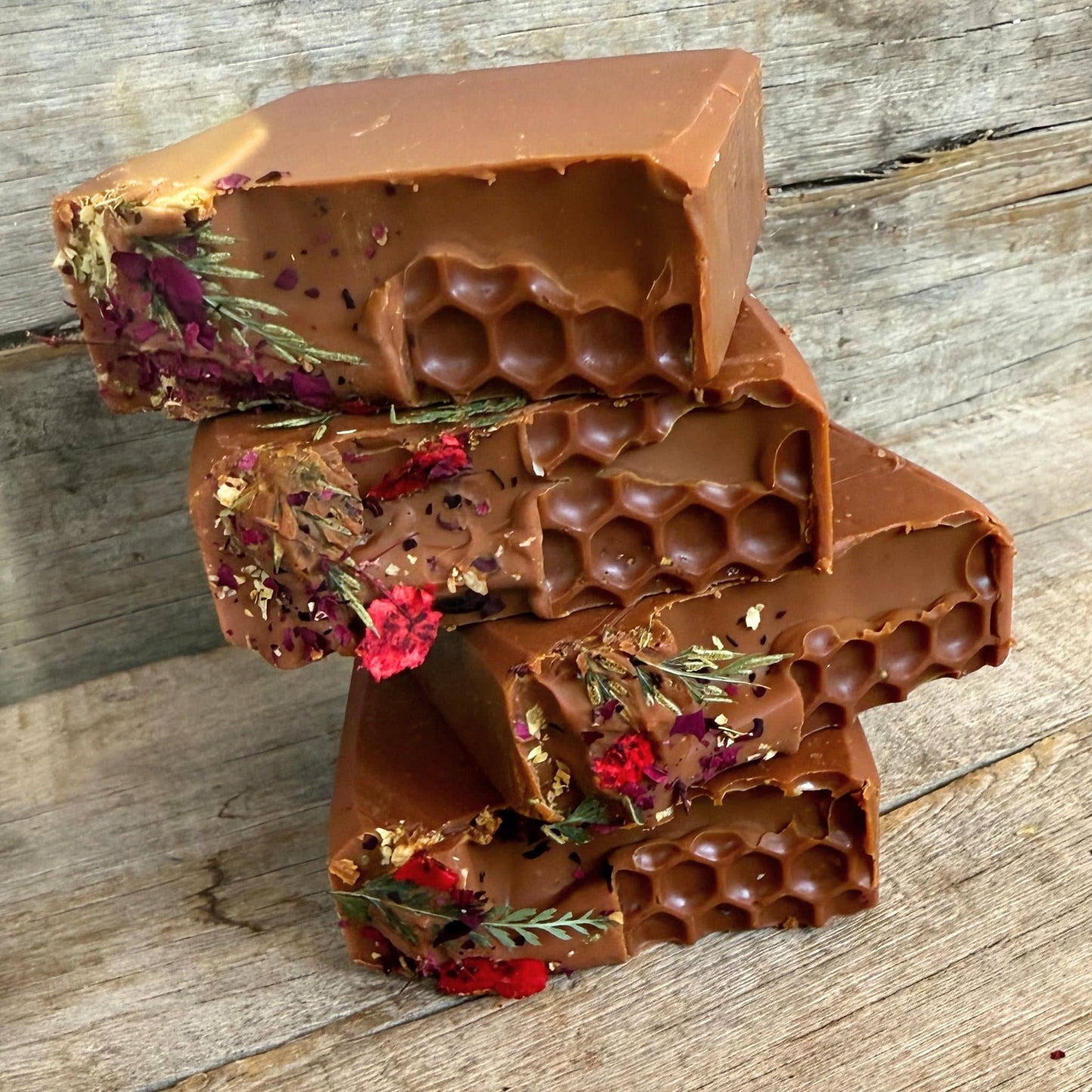 Stacked Casablanca Curing Clay soaps, featuring organic tallow skincare and propolis healing properties.