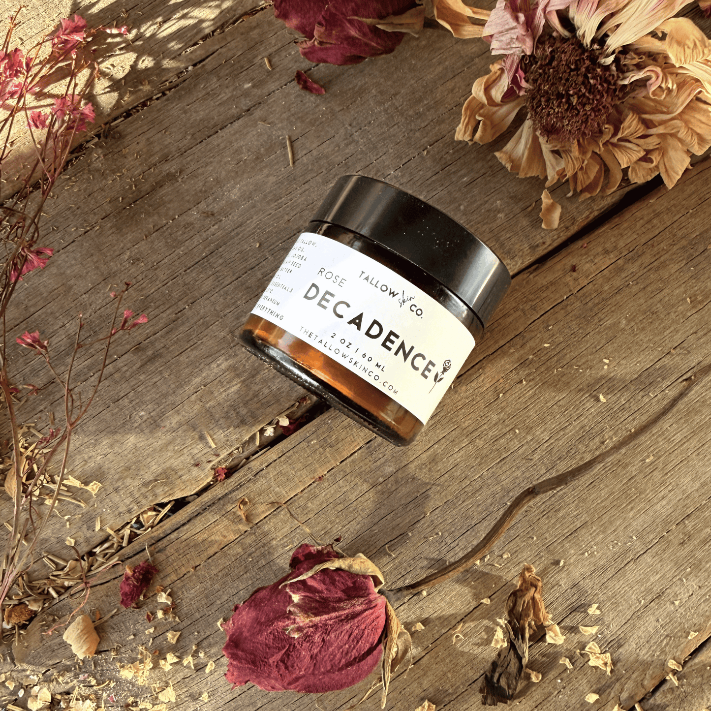 Elegant display of rose petals and glass product jar