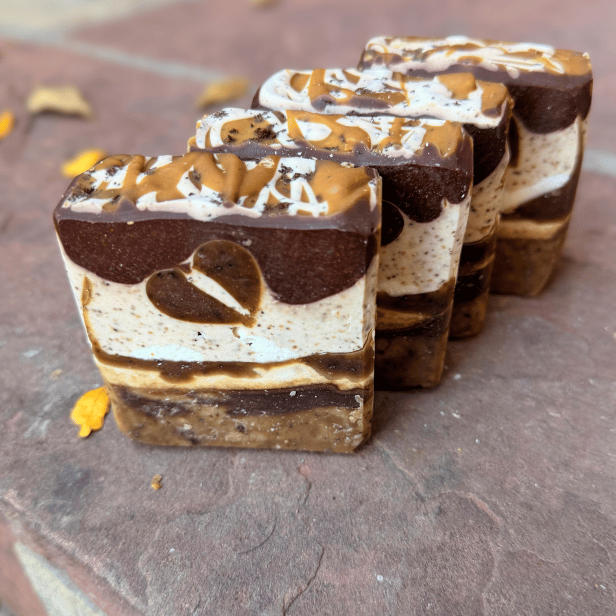 Four Coffee Candy tallow soap bars showcasing unique cocoa and vanilla layers