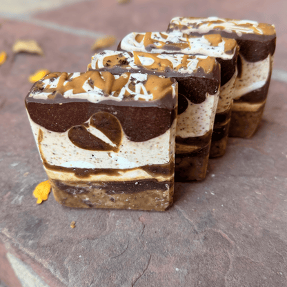 Four Coffee Candy tallow soap bars showcasing unique cocoa and vanilla layers