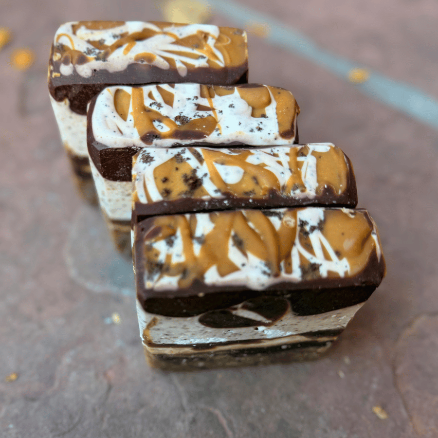 Artisan coffee soap bars featuring dark cocoa layers and creamy marbled patterns