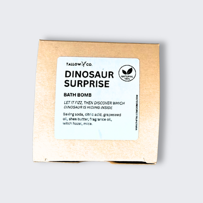 Tallow Skin Co. Dinosaur Surprise Bath Bomb packaging showing product name, description, and ingredients.