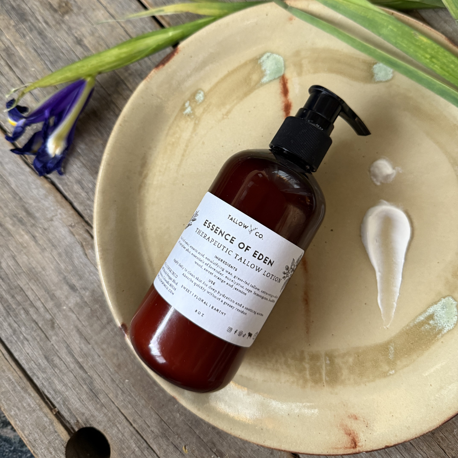 Close-up of natural tallow lotion being applied to hydrated skin