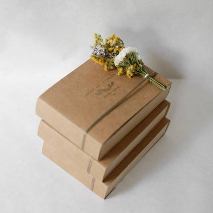 Handmade wooden gift box opening to reveal five plastic-free makeup sticks