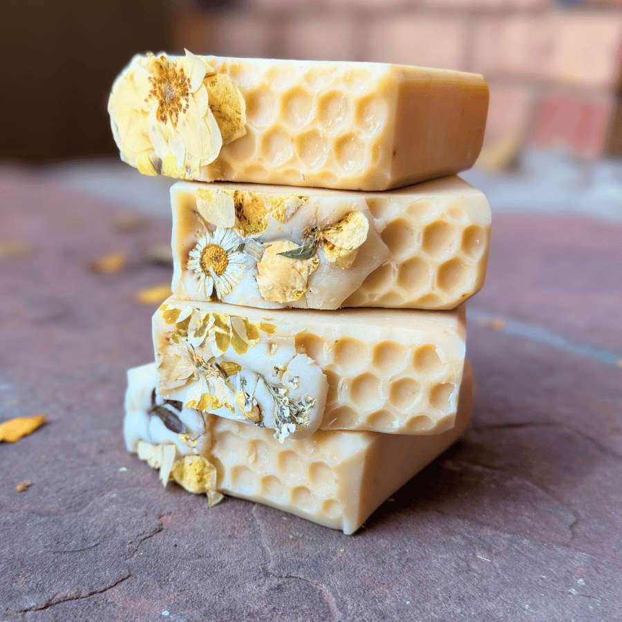 Stacked Apricot Freesia soap bars showcasing honeycomb texture, dried flowers, and creamy peach coloring