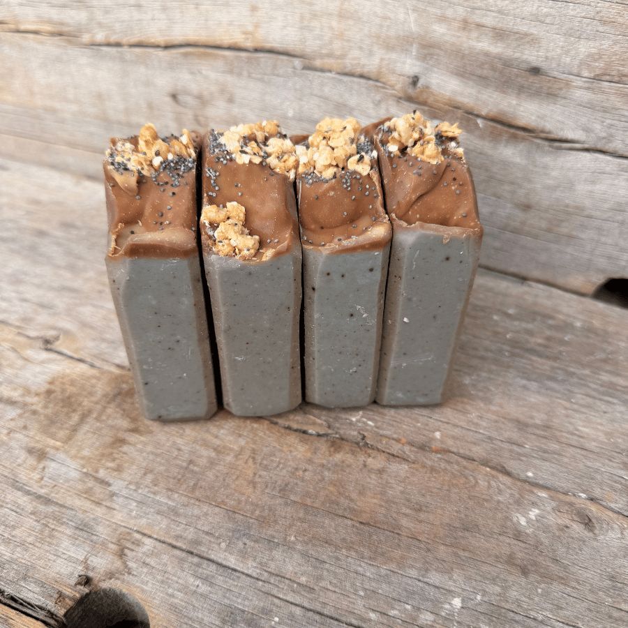 Blueberry Muffin tallow soap bars made with wild blueberry purée, colloidal oats, indigo, granola, and poppy seeds.