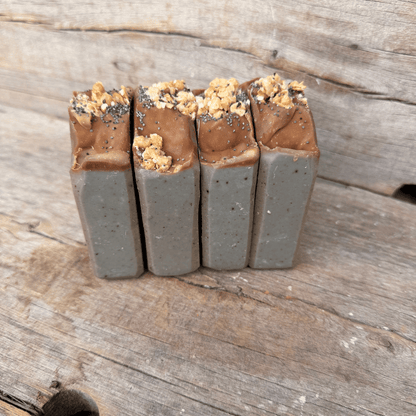 Blueberry Muffin tallow soap bars made with wild blueberry purée, colloidal oats, indigo, granola, and poppy seeds.
