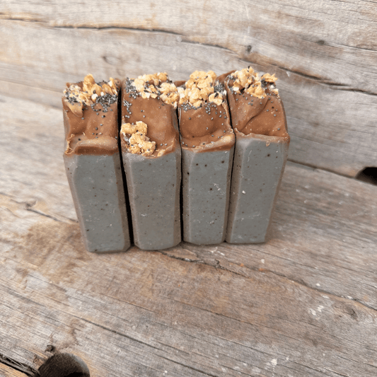 Blueberry Muffin tallow soap bars made with wild blueberry purée, colloidal oats, indigo, granola, and poppy seeds.