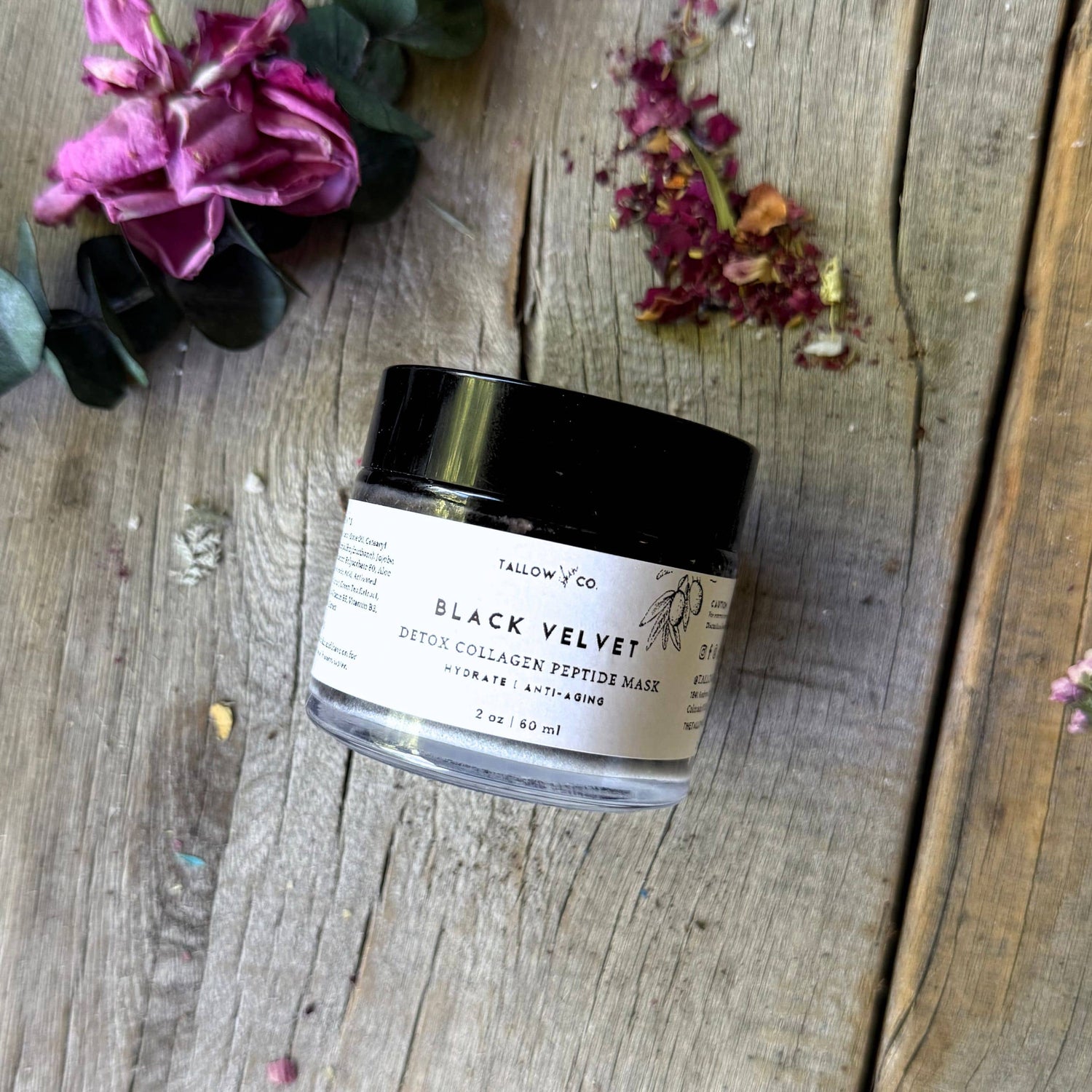 Applying black velvet charcoal mask to clear congested pores