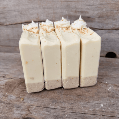 Coconut Cream Pie tallow soap bars with an exfoliating oat and cocoa crust, creamy coconut layer, and piped topping.