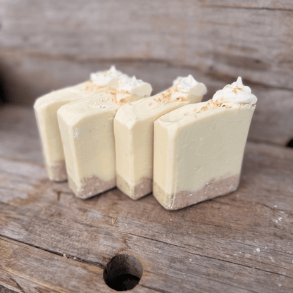 Small-batch Coconut Cream Pie tallow soap bars with toasted coconut, colloidal oats, and a textured exfoliating crust.