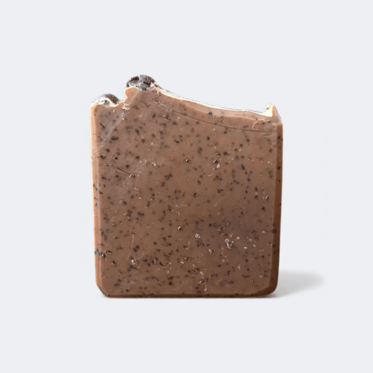 Mocha Fudge Exfoliating Coffee Tallow Soap bar showing real coffee grounds