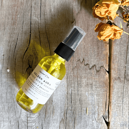 Close-up application of Golden Aura cleanser for a radiant glow
