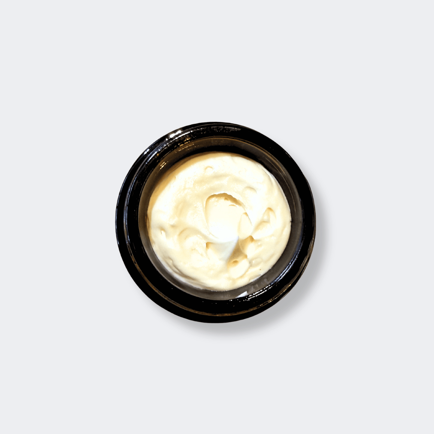 Application of Rose Decadence cream onto glowing, hydrated skin