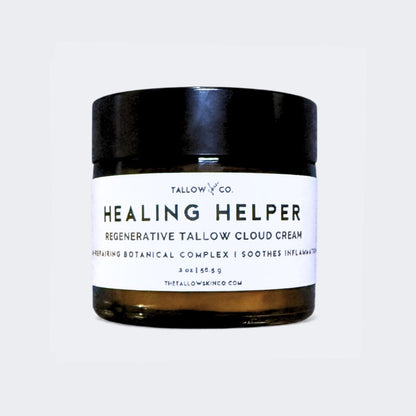 Applying a natural grass-fed tallow cream to calm irritated, stressed skin
