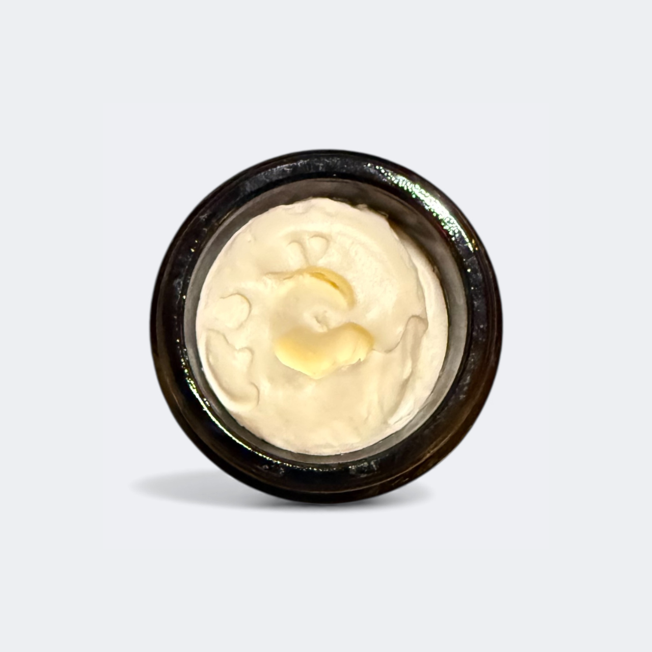 Cooling Cucumber and Elderflower Eye Cream jar on a minimalist background