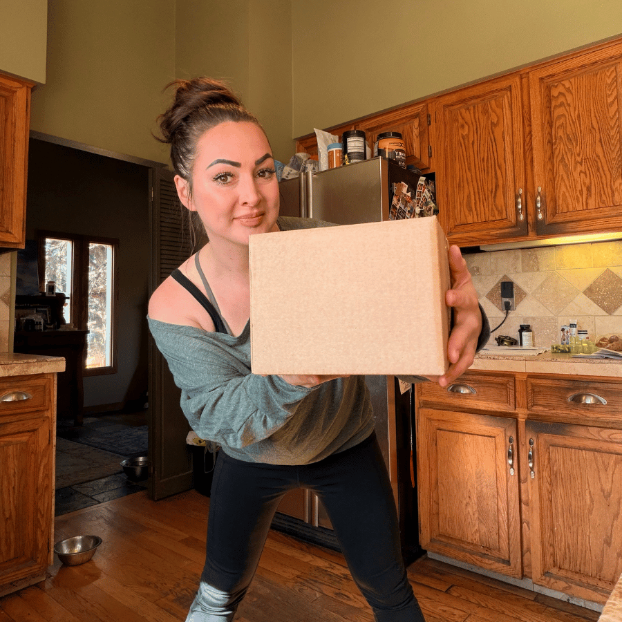 Tallow Skin Co. founder presenting a mystery skincare gift box, featuring a surprise assortment of thoughtfully curated, handcrafted skincare, bath, and body care favorites.