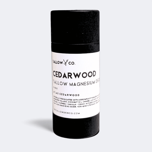 Full-size Cedarwood Tallow Magnesium Deodorant in a black paperboard tube with white product label against a light gray studio background.